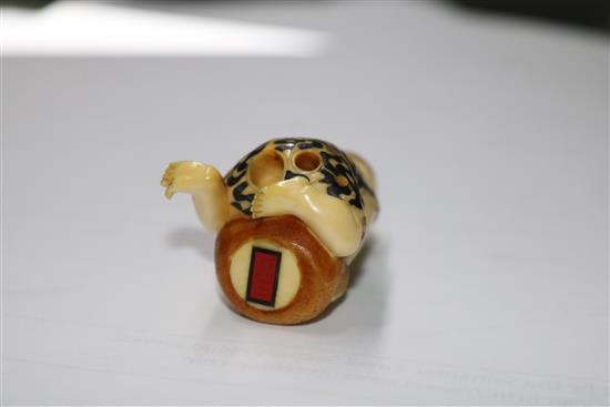 A Japanese ivory inlaid figurative netsuke